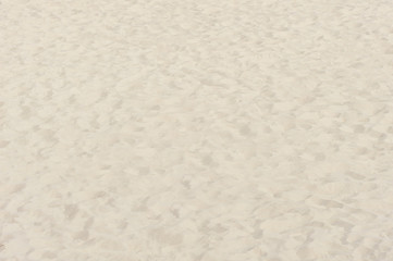 Fine beach sand in the summer sun