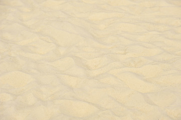 Fine beach sand in the summer sun_