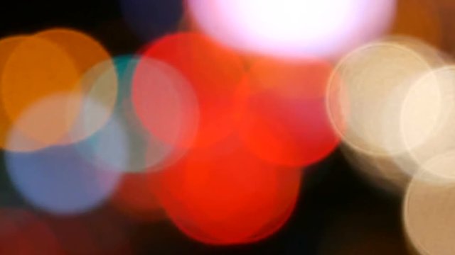 Footage of Night city street lights bokeh background, Defocused car lights, Abstract colorful bokeh