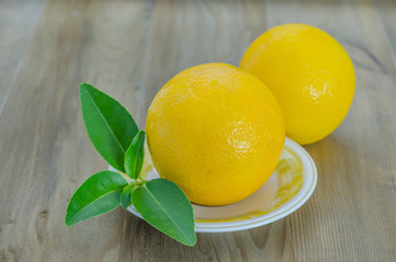 orange with leaves on dish