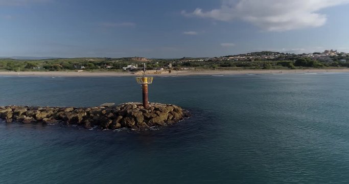 360 drone flight around a lighthouse in Altafulla, on the coast of the Mediterranean Sea
