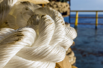 Obraz premium Hawser mooring rope on a construction barge at oilfield 