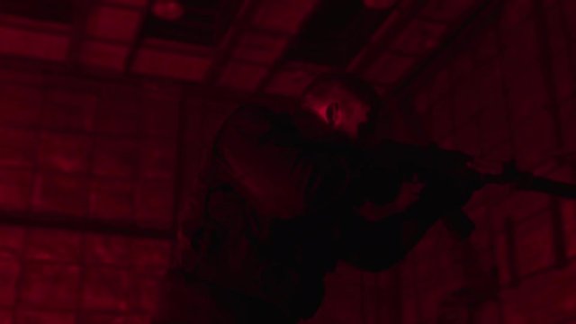 Soldier in the smoke moving in battle operation. Stock. Military commando on a mission in Smoke