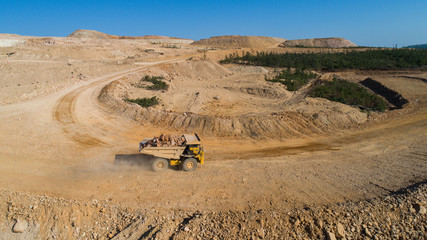 Dump truck Truck transports in the career of the ground © suvorovalex