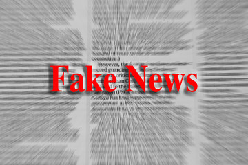 Fake news written in red with a newspaper article blurred in the background