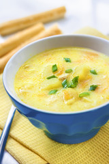 Cheese soup with chicken, potatoes and turmeric