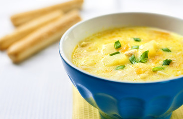 Cheese soup with chicken, potatoes and turmeric