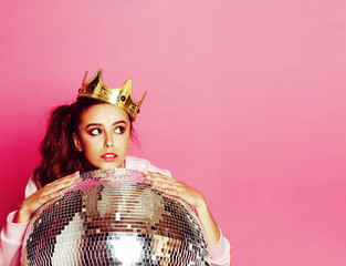 young cute disco girl on pink background with disco ball and cro