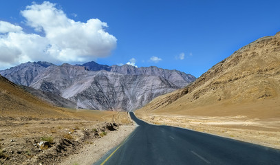 Fototapeta na wymiar Scenic Leh Manali highway road surrounded with barren mountain ranges at Ladakh India.