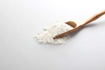 Fototapeta na wymiar flour spoon spatula on a light background