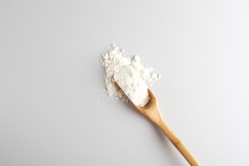 flour spoon spatula on a light background