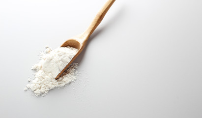 flour spoon spatula on a light background