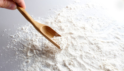 flour spoon spatula on a light background