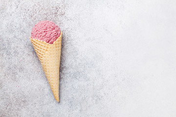 Ice cream cone with berry scoop