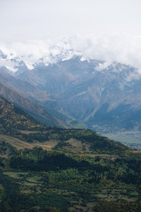 Mountain top in cumulus clouds