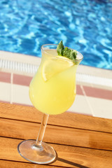 Cold lemonade with lemon and mint pool