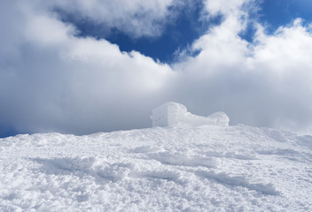 Winter landscape with old observatory in the mountains
