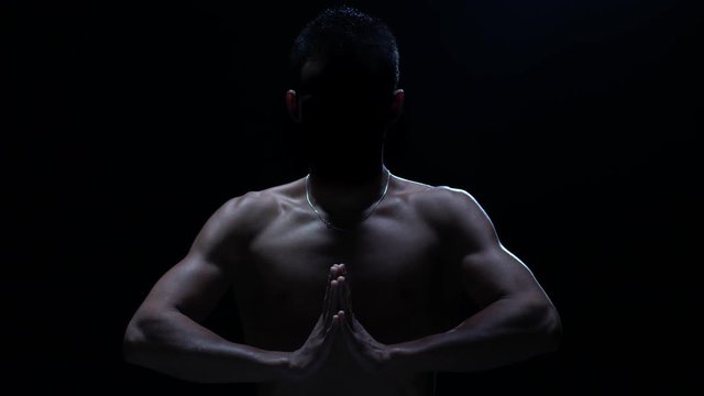 Muay thai Silhouette. Silhouette of a Thai fighter in the dark. Concept of balance