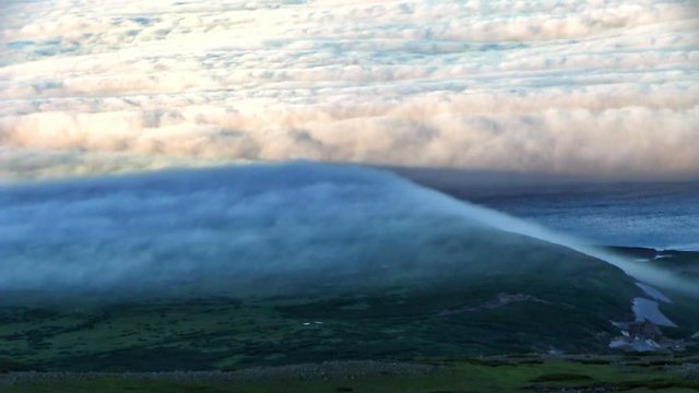 Timelapse the fog in the sea over Paramushir Island. North Kuril, Russia 