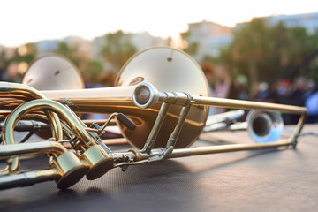 wind instruments lying on a table against a blurred background