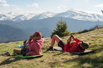 travelers who are resting in the mountains