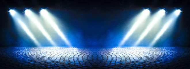 Background of an empty dark room. Empty walls, lights, smoke, glow, rays