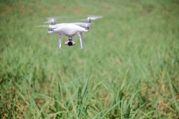Drone flying at field. Concept of technology in the farm.