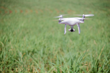 Drone flying at field. Concept of technology in the farm.