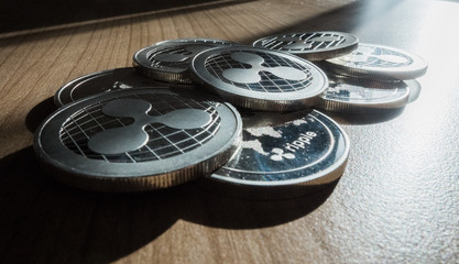 Ripple XRP crypto currency coins stack on table