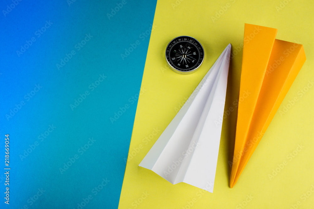 Poster travel concept with origami plane on color paper background. copy space for text and design.