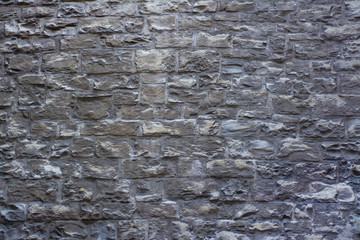 The old wall of stone blocks