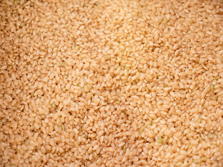 lot of brown rice texture, food background.
