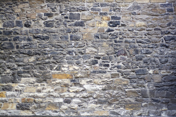 The old wall of stone blocks