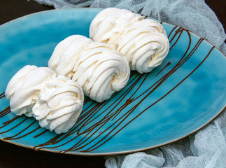 white marshmallow on a beautiful blue plate