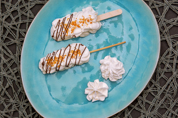 white marshmallow on a beautiful blue plate