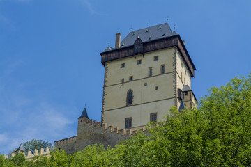 Fototapeta premium The tower of the old castle Karlstein in the forest