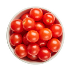 Fresh ripe tomatoes in ceramic bowl isolated on white background. Ingredients for cooking. Top view.