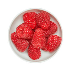 Fresh ripe raspberries in ceramic bowl isolated on white background. Ingredients for cooking. Top view.