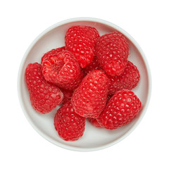 Fresh ripe raspberries in ceramic bowl isolated on white background. Ingredients for cooking. Top view.