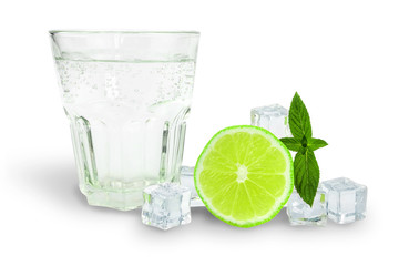 a glass of soda next to ice, mint and lime, ingredients for lemonade