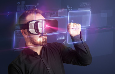 Amazed businessman with virtual reality charts and data in front of him