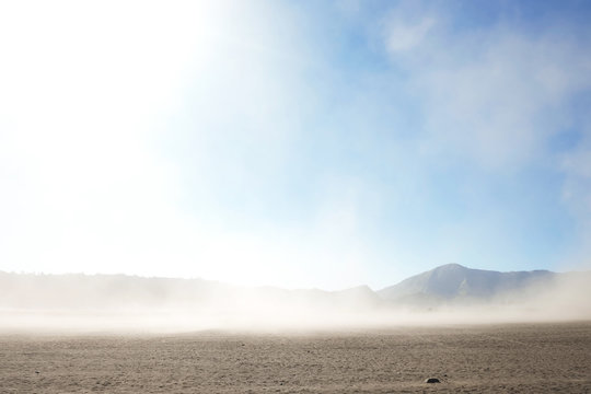 Landscape Of Desert And Sand Strom With No People At Bromo Valcano, Indonesia. Mountain And Sky Background