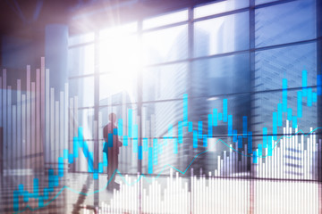 Stock trading candlestick chart and diagrams on blurred office center background.