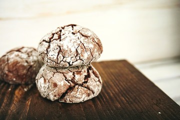 Chocolate biscuits on a wooden table. brown board. close-up.