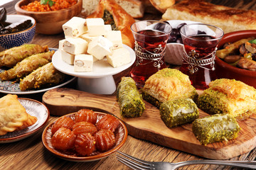 Middle eastern or arabic dishes and assorted meze, concrete rustic background. sambusak. Turkish...
