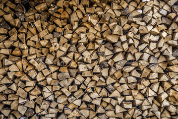 Wall made of firewood and wood. texture