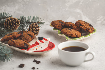 Christmas cookies with chocolate in christmas plate and cocoa, white background. Christmas background concept.