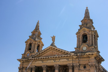 Fototapeta na wymiar Top part of facade of St. Publius' Church in Floriana Malta