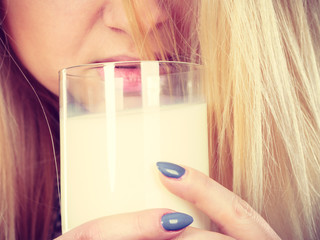 Woman drinking milk from glass