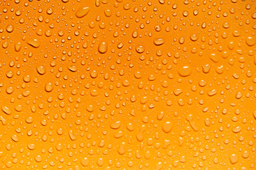 Water drops on yellow background, for design and advertising